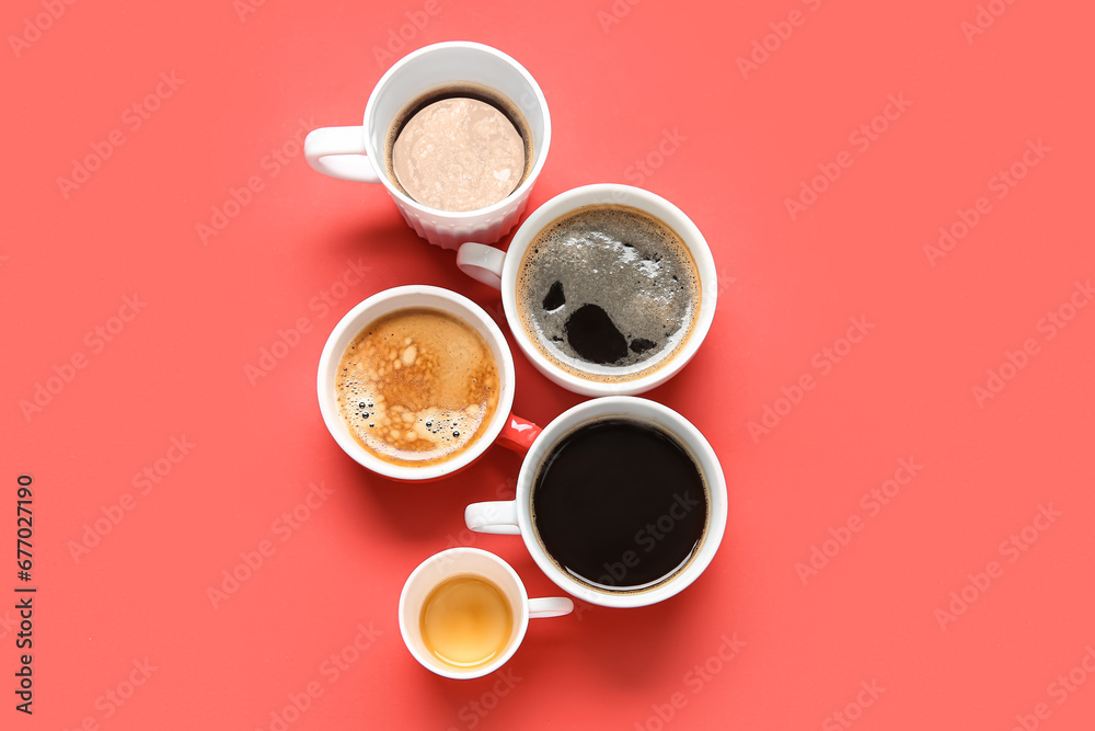 Many cups of hot coffee on red background