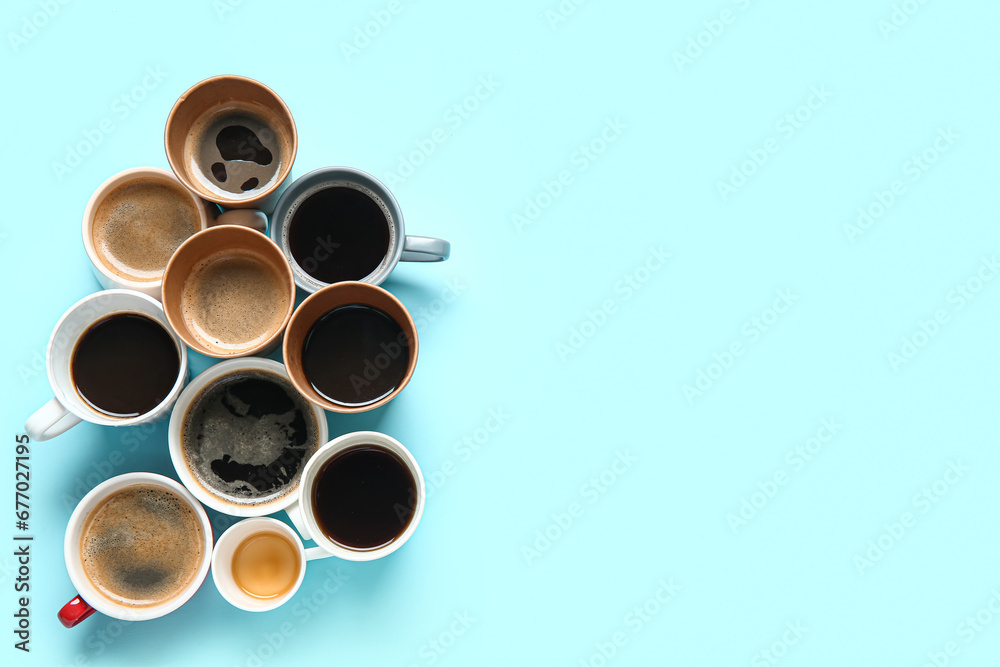 Many cups of hot coffee on blue background