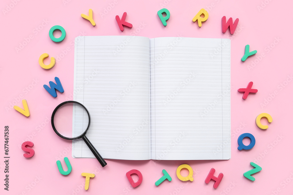 Composition with blank open notebook, magnifier and colorful letters on pink background