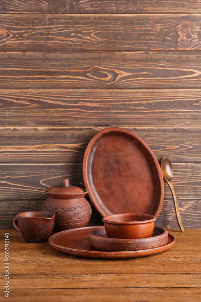 Set of clean dishes on wooden table