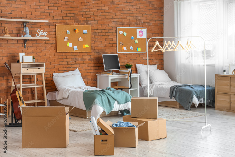 Cardboard boxes in dorm room on moving day