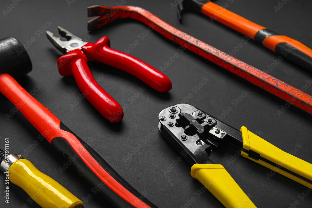 Set of construction tools on black background