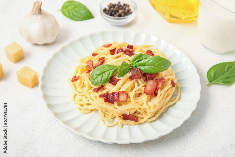 Plate with tasty pasta carbonara on white background