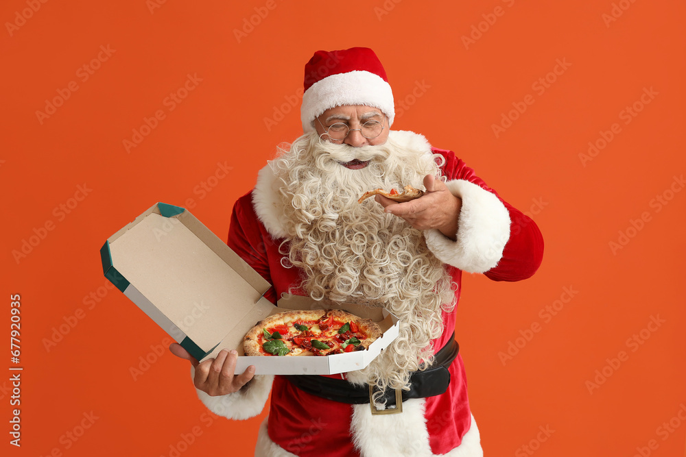 Santa Claus eating tasty pizza on orange background