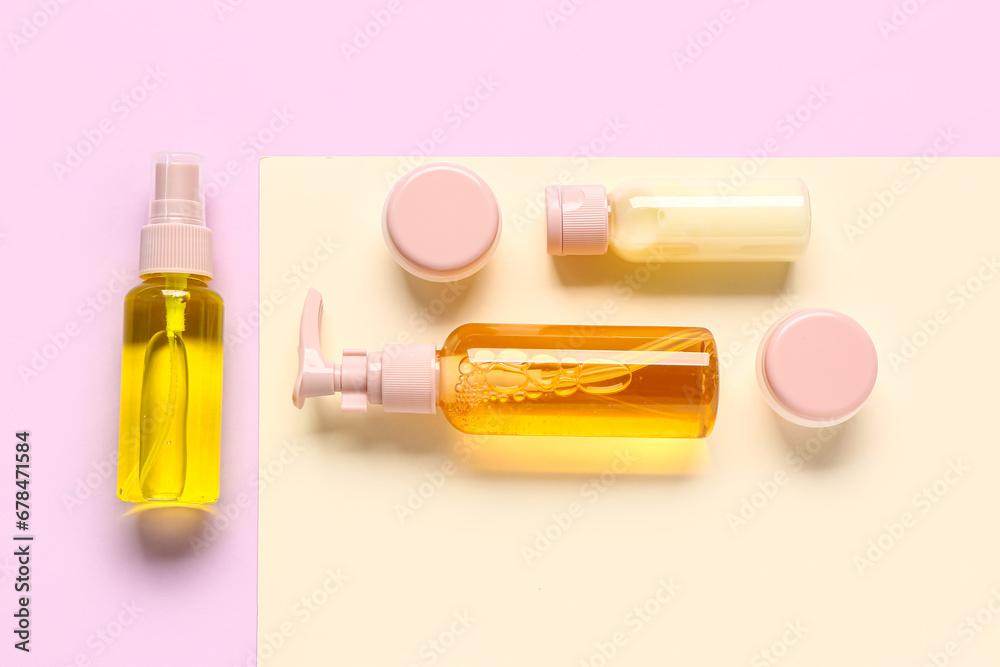 Set of different travel cosmetic products on color background