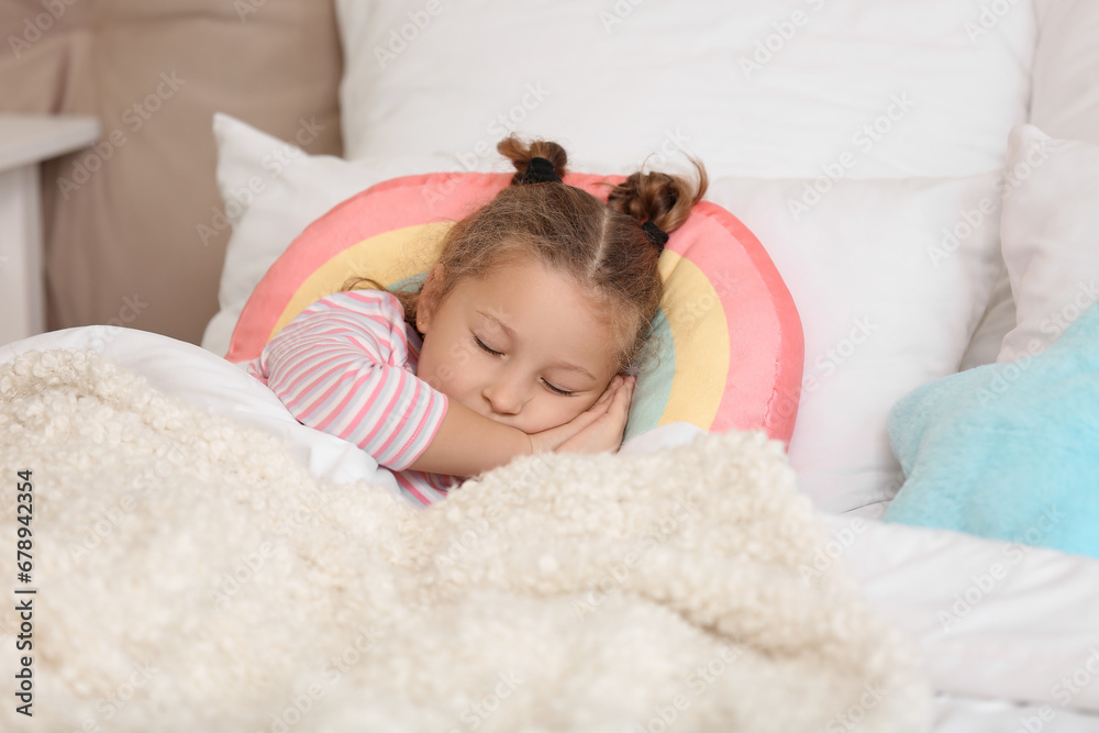 Cute little girl sleeping in bedroom