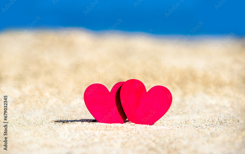 romantic symbol of two hearts on the beach 