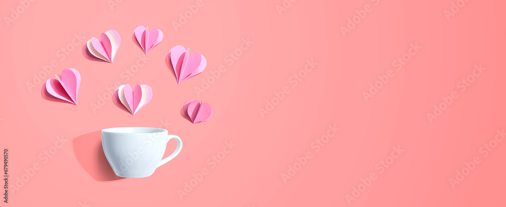 Coffee cup with paper craft hearts - flat lay