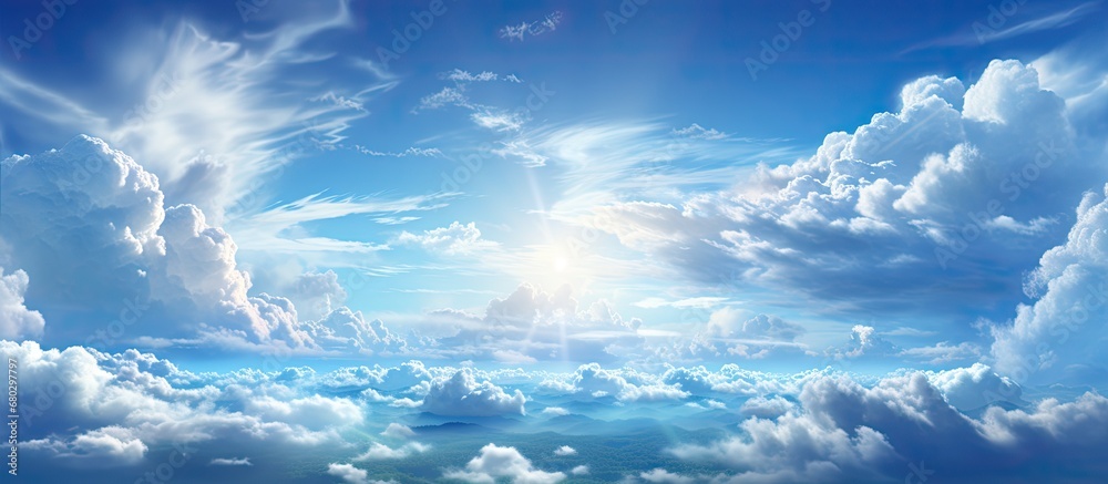 In the abstract beauty of the summer sky, natures landscape is transformed with a burst of light and space, as the suns white rays dance with fluffy white clouds against the stunning backdrop of the