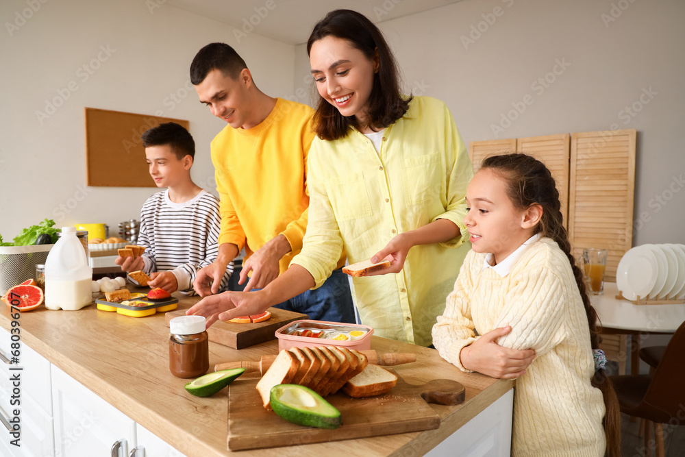 Happy family cooking in kitchen