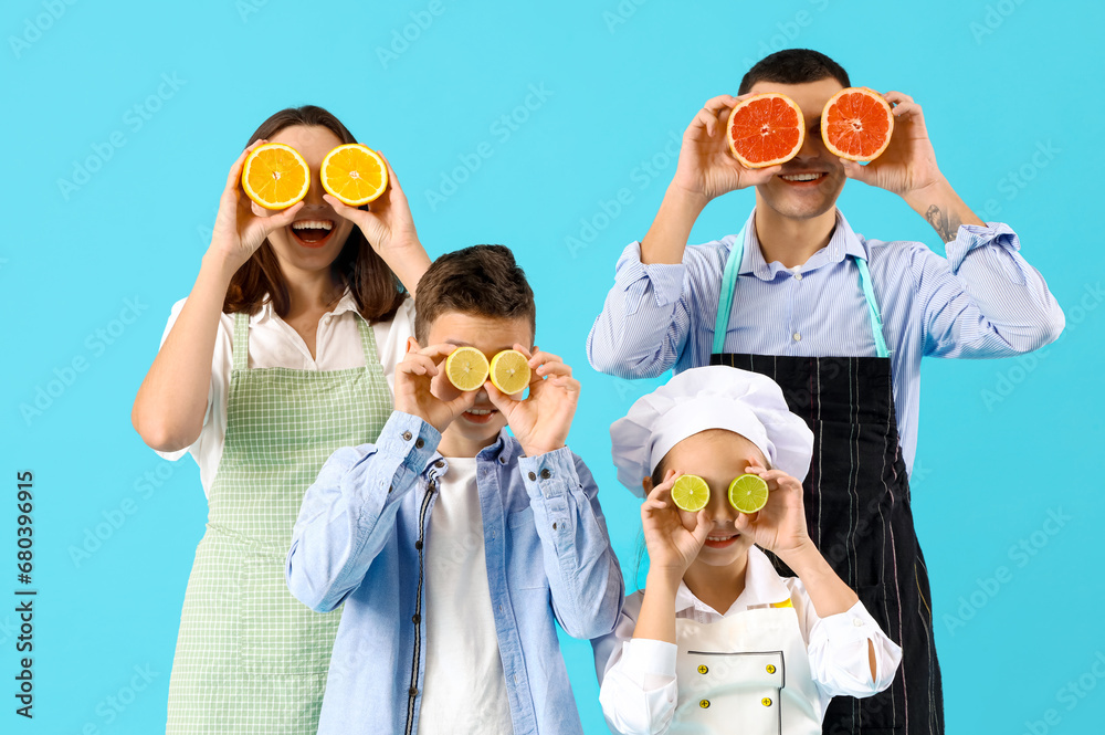 Happy family with citruses on blue background