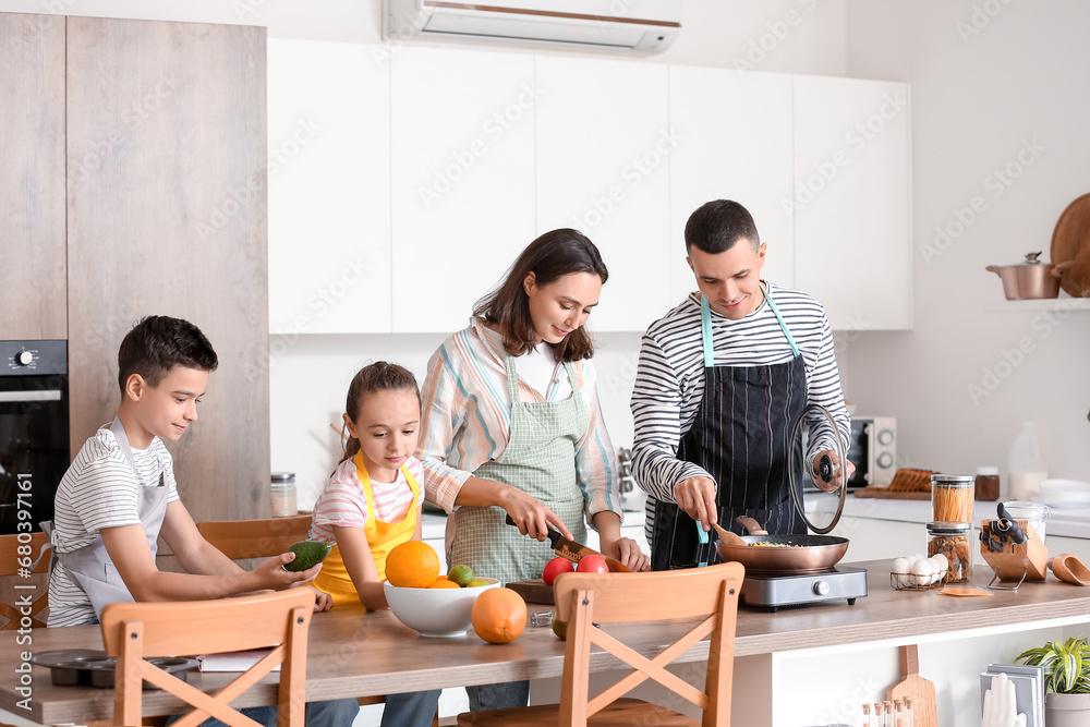 Happy family cooking in kitchen