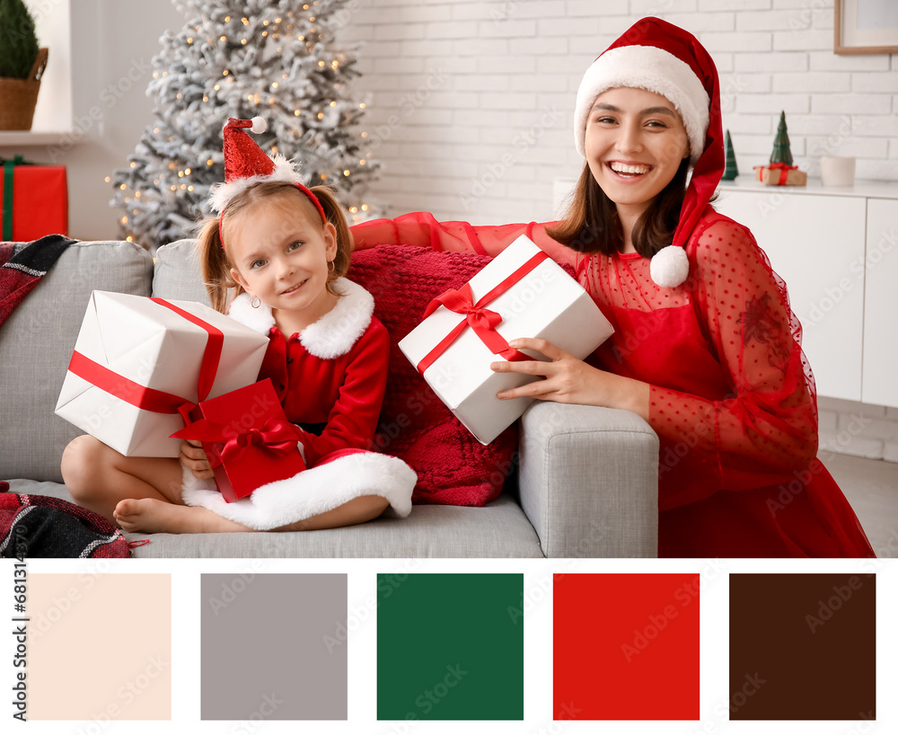 Happy mother and her little daughter with Christmas gifts at home