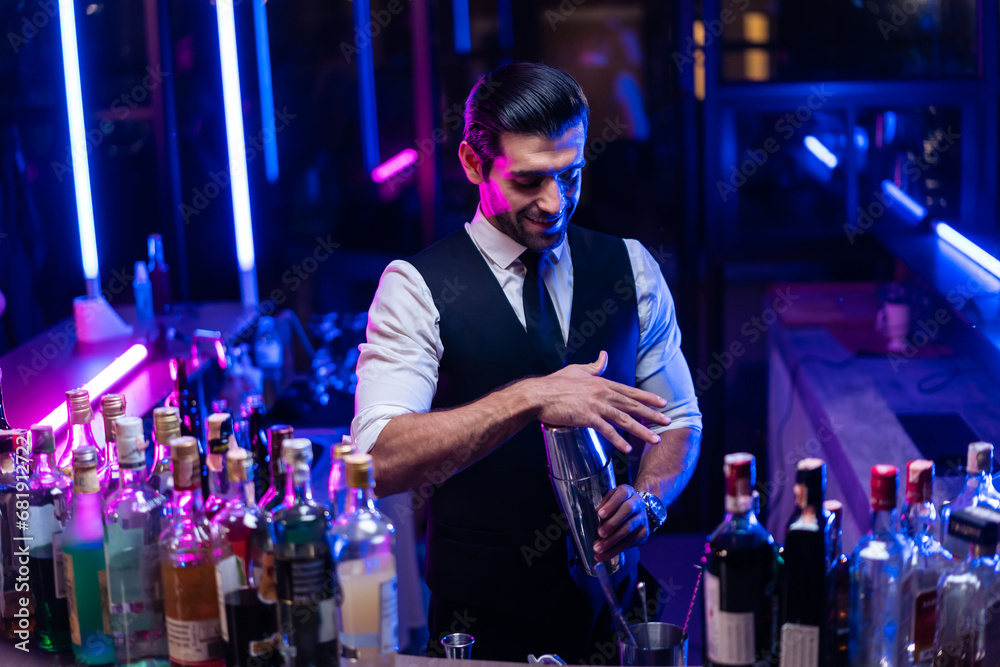 Caucasian profession bartender making a cocktail for women at a bar. 