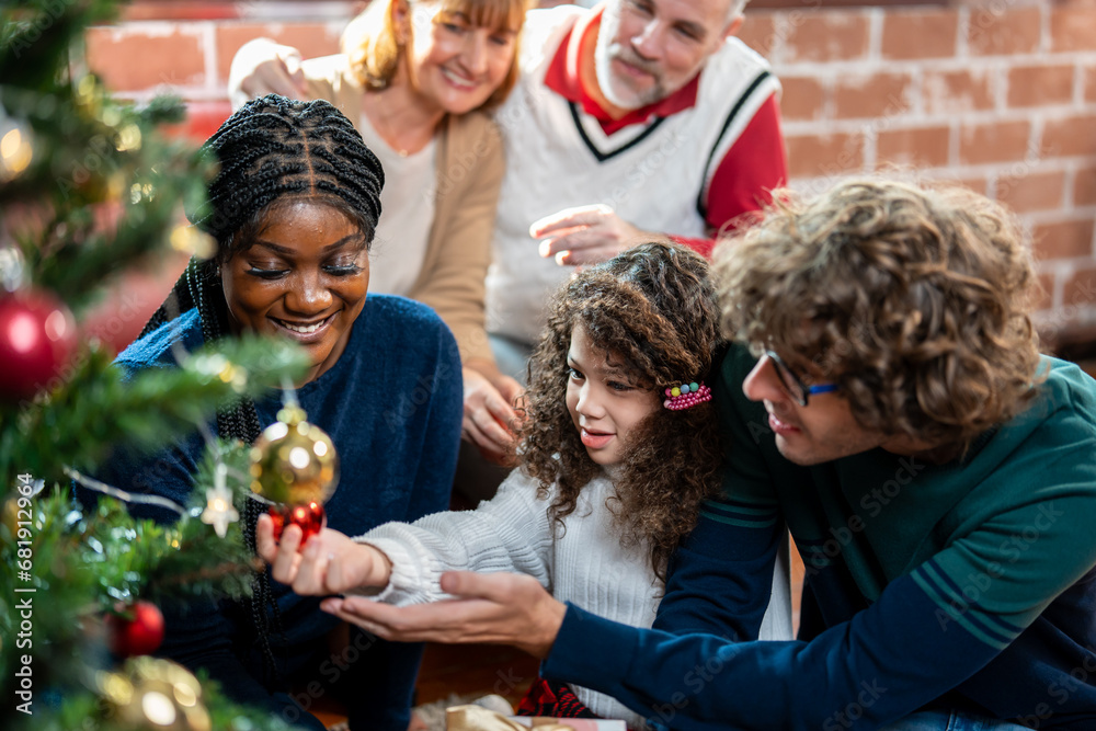 Caucasian family and kid daughter decorating Christmas tree in house. 