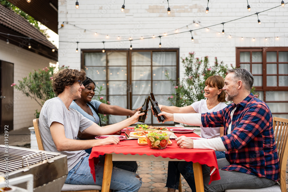 Multi-ethnic family having fun, enjoy party outdoors in the garden. 