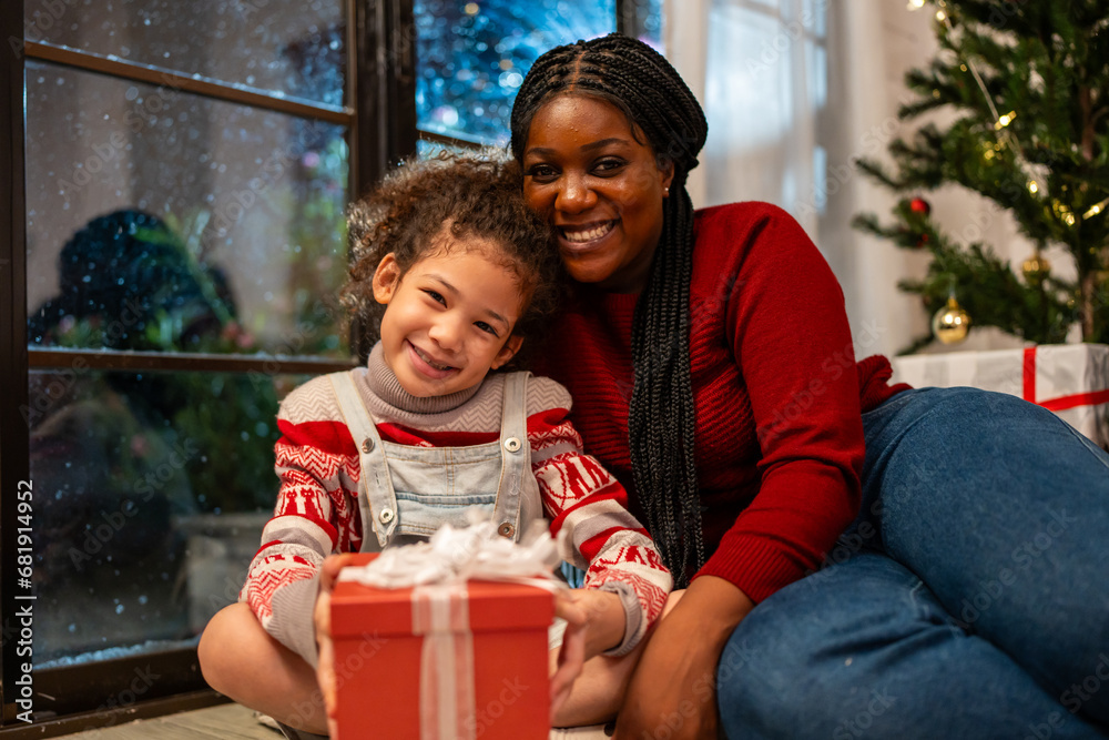 Portrait of African American family celebrate Christmas party in house. 