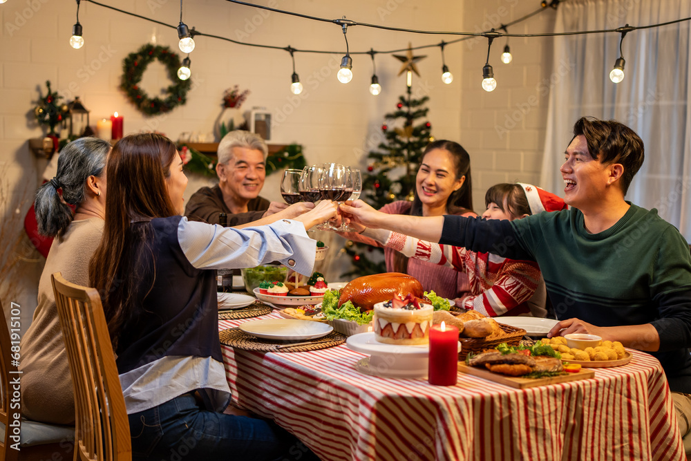 Asian lovely family celebrating Christmas party together in house.  